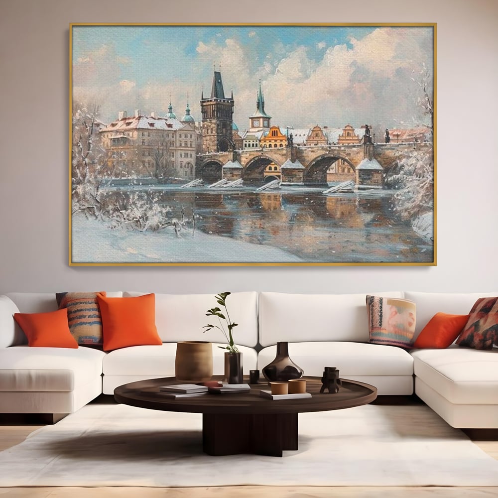Tablou canvas cu pictura cu podul carol din praga iarna, in rama de aluminiu auriu, pe perete intr-un living